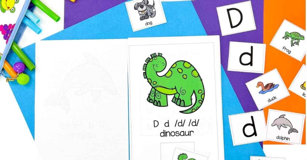Letter D alphabet reader adapted book showing a dinosaur piece being matched to the page showing d d dinosaur