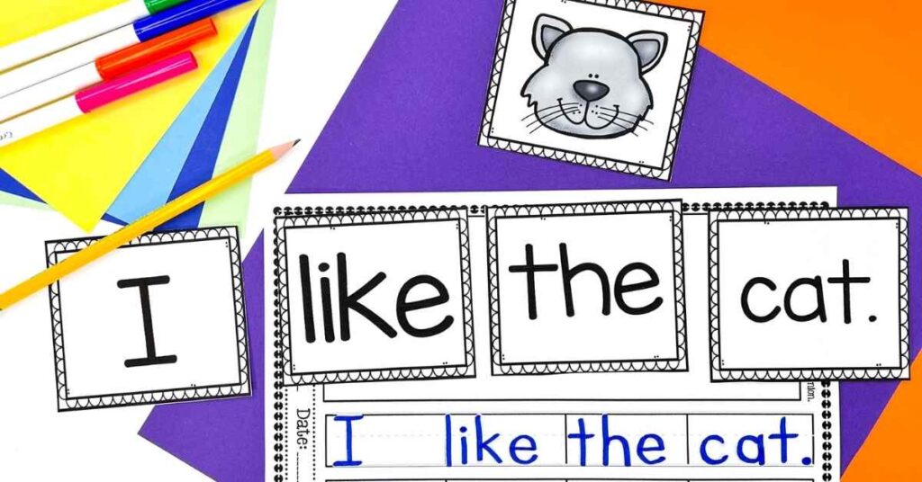 Word cards to build and then write a sentence "I like the cat" with a picture of a cat.