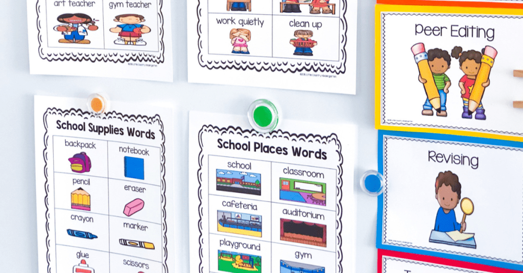 whiteboard showing vocabulary charts for school supplies and school places words utilized during the first days of kindergarten